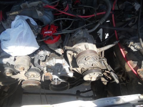 1991 Ford Bronco - Close-up view of an engine bay, showing mechanical components and wiring.