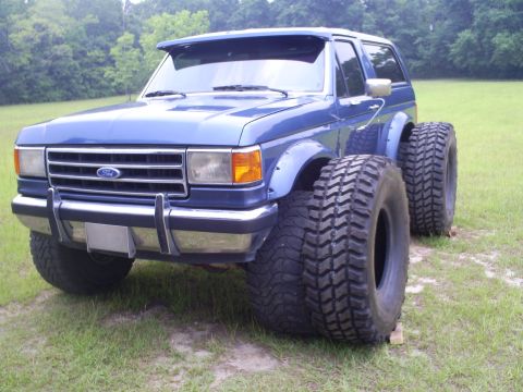 1992 Ford Bronco - This modified Ford Bronco sits high on enormous tires, altering its original appearance.