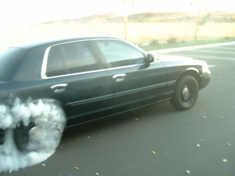 1998 Ford Crown Victoria - 1998 Ford Crown Victoria performing a burnout on asphalt.