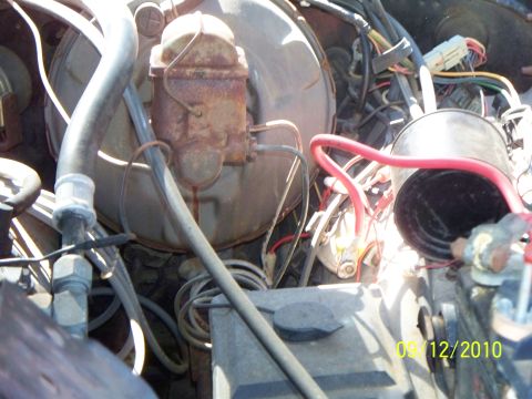 1979 Ford F-250 - Close-up view of the engine bay, focusing on the brake system components and associated wiring.
