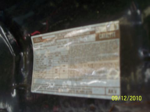 1979 Ford F-250 - A close-up view of a vehicle identification sticker, showing various text and numerical data.