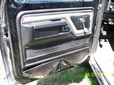 1979 Ford F-250 - Close-up of a worn truck door interior with a date stamp in the corner.