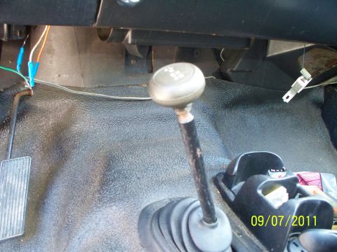 1979 Ford F-250 - The interior of a truck shows a manual transmission shifter and pedals, with a date stamp of 09/07/2011.