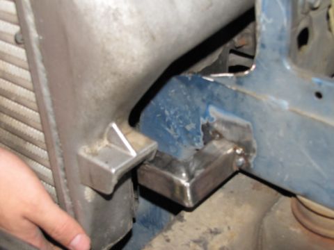 1993 Ford F-250 - Custom bracket welded to the blue frame for intercooler installation.