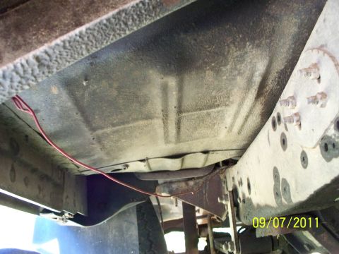 1979 Ford F-250 - Underside view of the frame and undercarriage of a 1979 Ford F-250, showing some wiring.