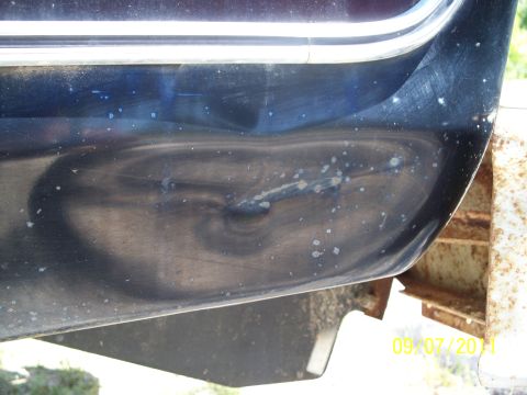 1979 Ford F-250 - Dented truck fender shows damage and wear.