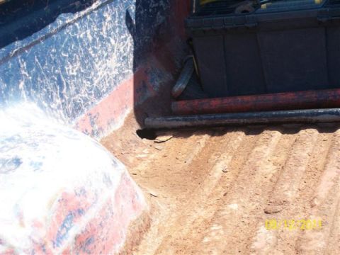 1979 Ford F-150 - The truck bed contains a black toolbox and some pipes, with a date stamp visible in the corner.