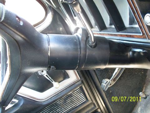 1979 Ford F-250 - Interior view of a vehicle's steering column, dashboard, and pedals, captured on 09/07/2011.