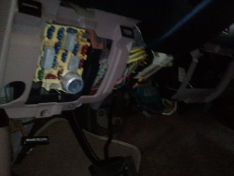 1994 Ford Bronco - The fuse box and associated wiring are visible inside the vehicle's cabin.