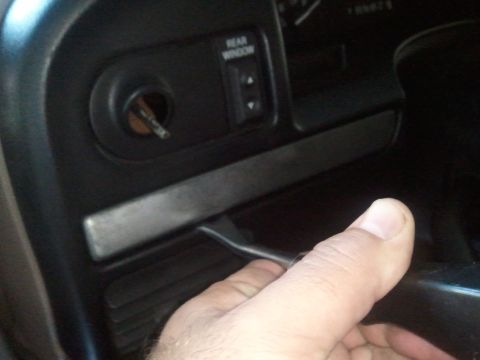 1994 Ford Bronco - Interior view of a 1994 Ford Bronco showing the ignition and rear window control.