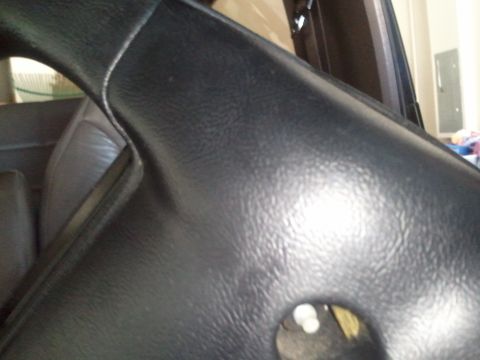 1994 Ford Bronco - Interior trim detail, focus on texture and shape.