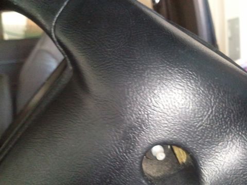 1994 Ford Bronco - A close-up view of the steering column cover inside a vehicle, with a Supermotors.net watermark.