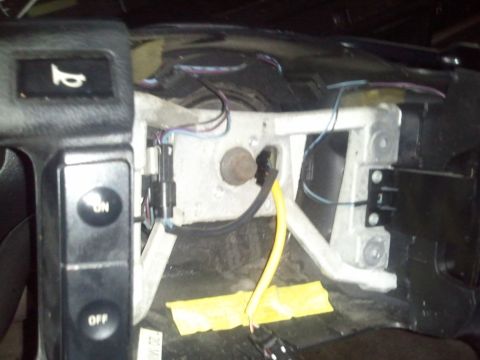 1994 Ford Bronco - Close-up of dashboard wiring and electrical components, including ON/OFF buttons.