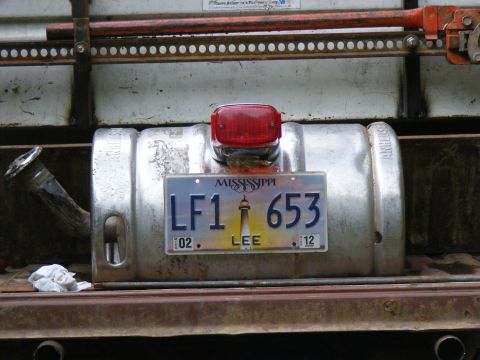 1978 Ford Bronco - A custom fuel tank is mounted on a vehicle, complete with a license plate and taillight.