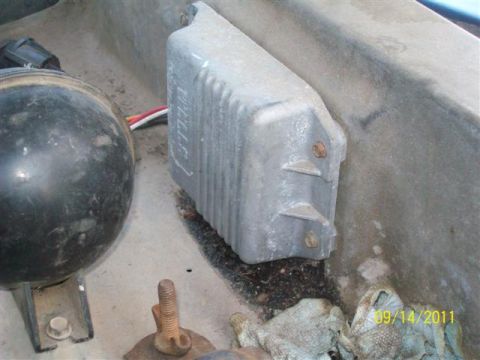 1979 Ford F-150 - Engine bay component with visible wiring and a black circular part.