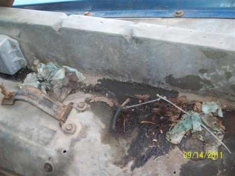 1979 Ford F-150 - Debris and grime accumulated in the engine bay, with a visible date stamp.
