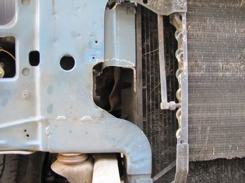 1993 Ford F-250 - Close-up view of the radiator and intercooler assembly, showing modifications to the vehicle's frame.