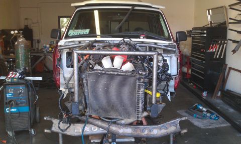 1992 Ford Ranger - A 1992 Ford Ranger is shown with its front end removed for custom fabrication work in a workshop.