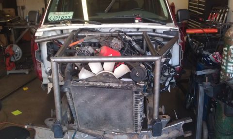 1992 Ford Ranger - This vehicle's engine bay is being modified with a custom roll cage structure.