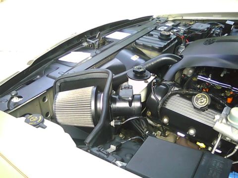2000 Mercury Grand Marquis - Close-up view of the engine bay in a 2000 Mercury Grand Marquis, showing the engine and air intake system.