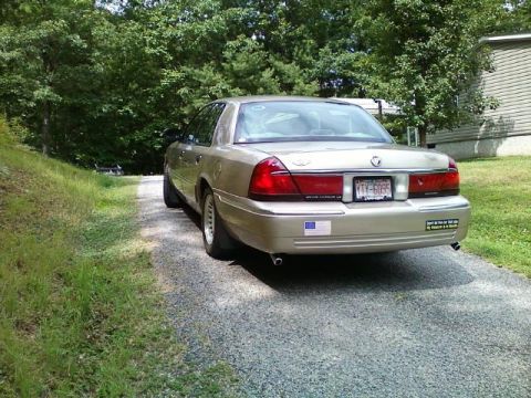 2000 Mercury Grand Marquis - This 2000 Mercury Grand Marquis is seen from the rear on a gravel driveway.