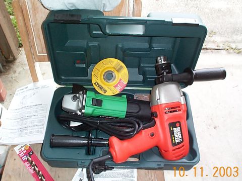 1992 Ford Bronco - Power tool kit includes a drill, angle grinder, and cutting disc, along with an instruction manual.