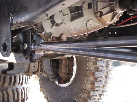 1995 Ford Bronco - Undercarriage view of a vehicle's rear suspension and differential assembly.