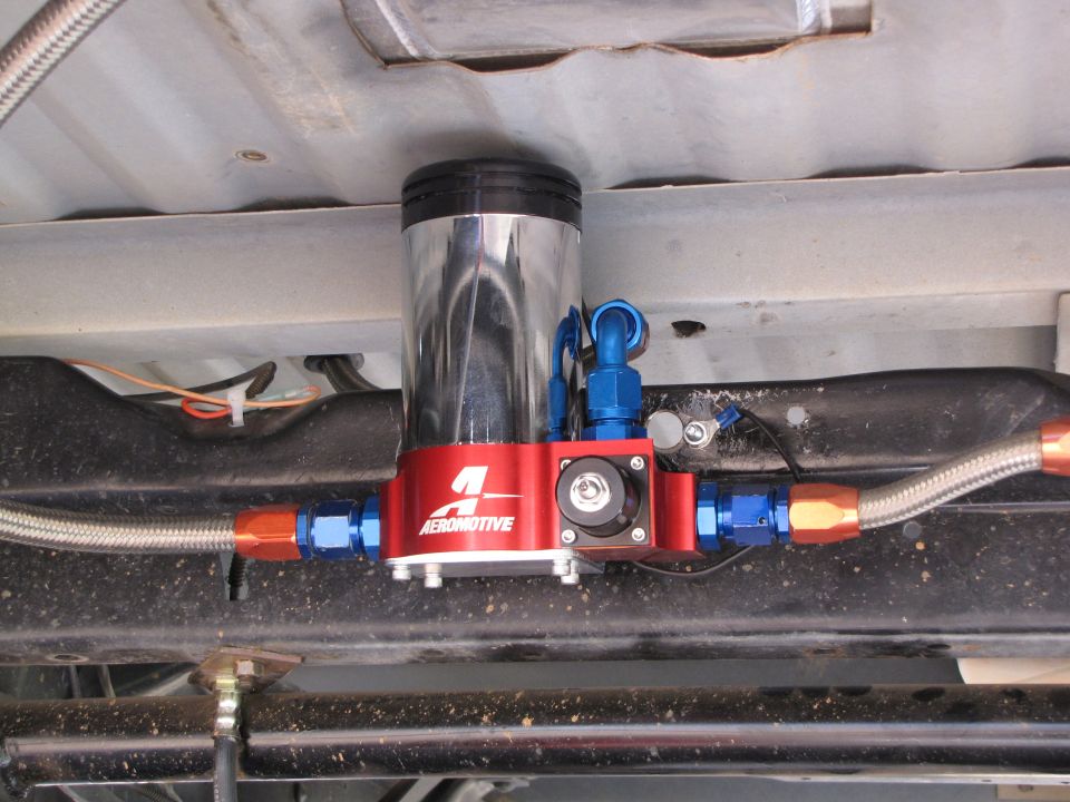 red Aeromotive fuel pump assembly with braided fuel lines