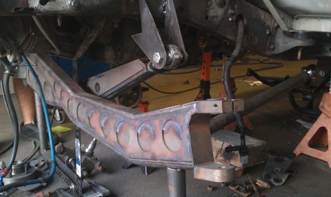 1992 Ford Ranger - Custom suspension fabrication is underway, with the vehicle chassis elevated on jack stands.