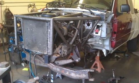 1992 Ford Ranger - This truck is undergoing significant modifications, including a custom front-end fabrication and chassis work, with the radiator and engine…