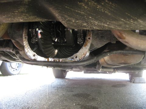 2003 Ford Crown Victoria - Close-up of a vehicle's rear differential and axle components, showing internal gears.