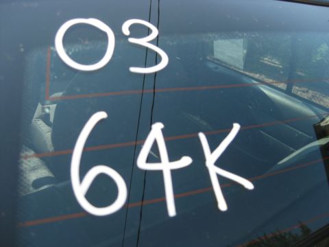 2003 Ford Crown Victoria - White text '03 64K' is visible on the rear window of a 2003 Ford Crown Victoria.