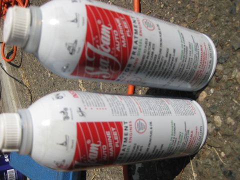 2003 Ford Crown Victoria - Two cans of Sea Foam motor treatment are shown, with text detailing their use for auto, marine, and fleet engines.