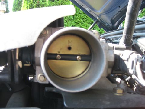2003 Ford Crown Victoria - The throttle body is a critical component of the engine's air intake system.