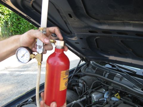 2003 Ford Crown Victoria - Performing fuel pressure test with a specialized tool and gauge.