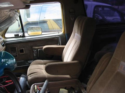 1986 Ford Bronco - Interior view of a 1986 Ford Bronco, highlighting the seats and door panel details.
