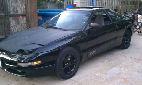 1994 Ford Probe - 1994 Ford Probe GT with a matte black hood and black wheels.