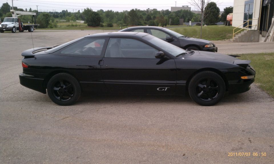 Black 1994 Ford Probe GT side view