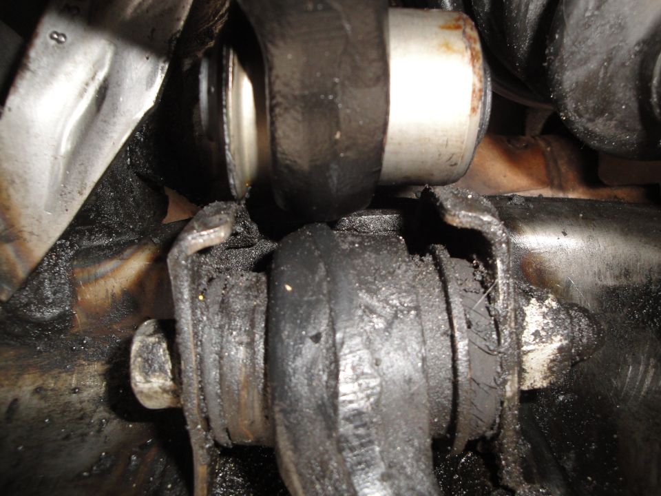 worn suspension bushings with grease and dirt