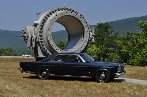 1965 Ford Galaxie - 1965 Ford Galaxie 500 coupe with a large industrial ring in the background.