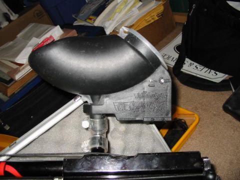 1986 Ford Bronco - Close-up of a paintball loader, identified by visible branding and mounting hardware.