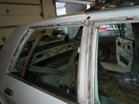 2001 Ford Crown Victoria - The interior of a vehicle is shown with its doors removed, indicating it is undergoing restoration or repair.