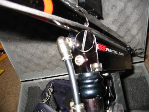 1986 Ford Bronco - A paintball marker is shown inside its protective case, with a portion of the website address visible on the side.