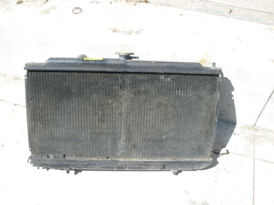 Used car radiator with black fins and plastic tanks