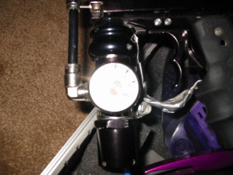 1986 Ford Bronco - Close-up of a gauge on a paintball marker, showing pressure readings.