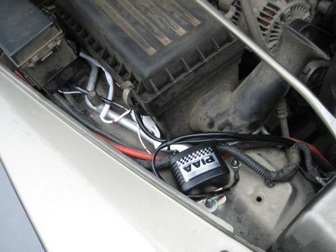 2005 Jeep Wrangler - Close-up view of the engine bay, showing PIAA lights and various electrical components.