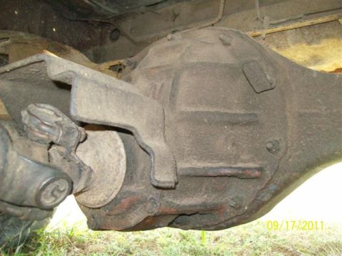 1979 Ford F-150 - Close-up of a rear differential and driveshaft assembly, showing wear and dirt.