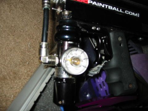 1986 Ford Bronco - This image shows a close-up view of a paintball gun, a pressure gauge and some text on the body.