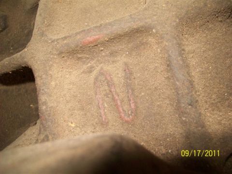 1979 Ford F-150 - A close-up view of a dusty metal component, possibly a differential housing, with red markings and a date stamp of 09/17/2011.