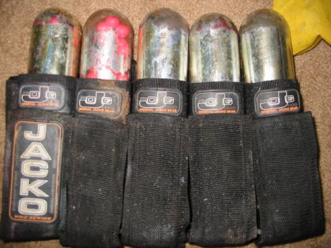 1986 Ford Bronco - Paintball pods and harness with 'Jacko Pro Series' branding visible.